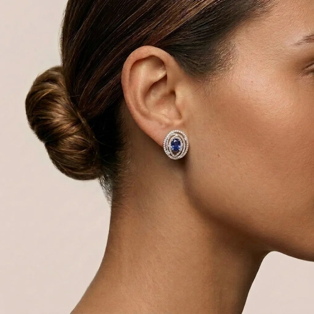 Oval Cut Blue Stone Spiral Halo Stud Earrings