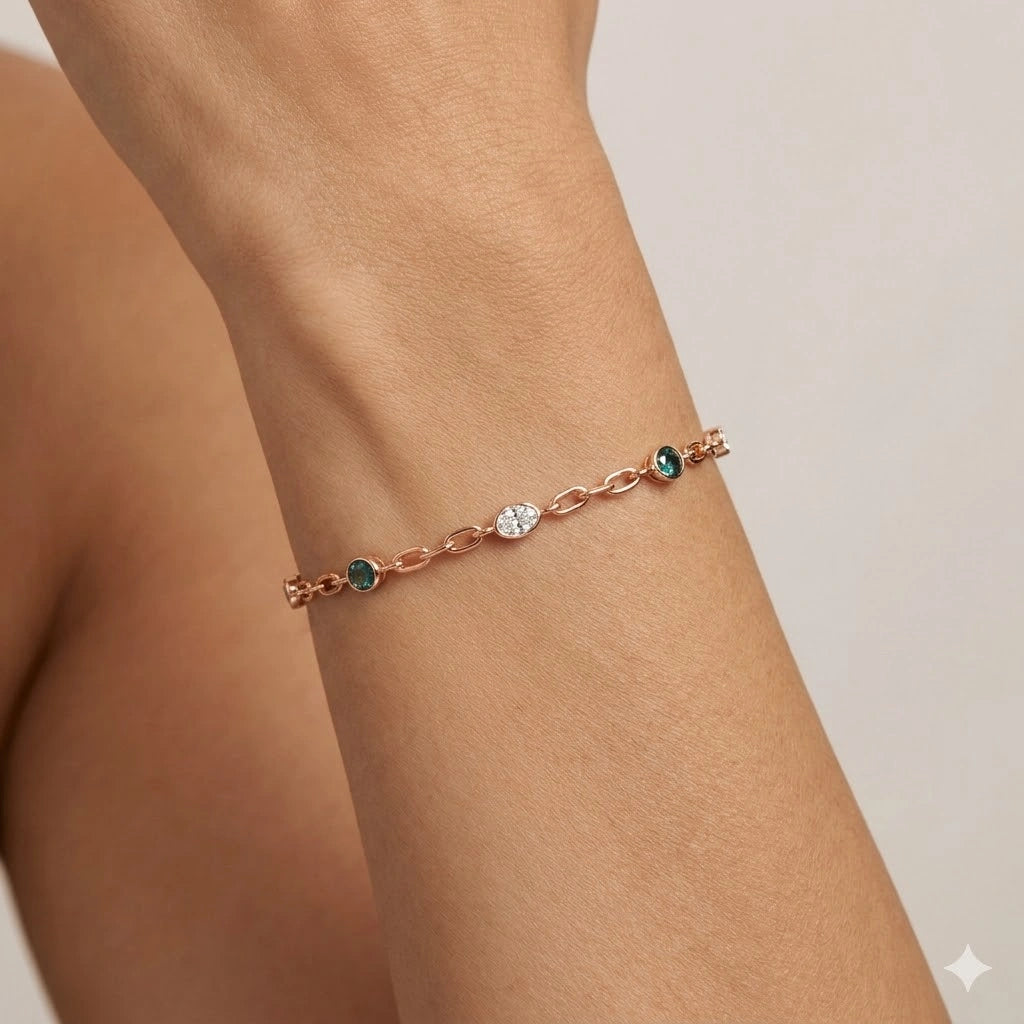 Oval Cut Diamond and SemiPrecious Emerald Station Bracelet