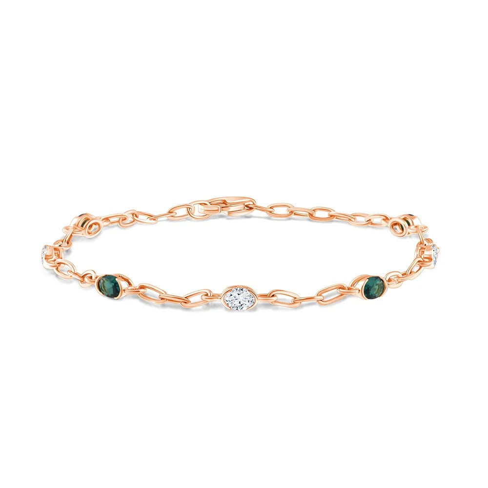 Oval Cut Diamond and Semi-Precious Emerald Station Bracelet
